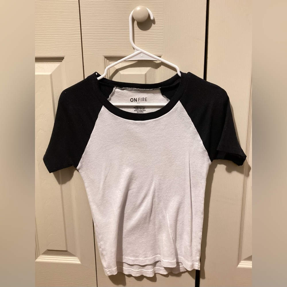 This back and white shirt is a casual fit. It goes with almost anything.